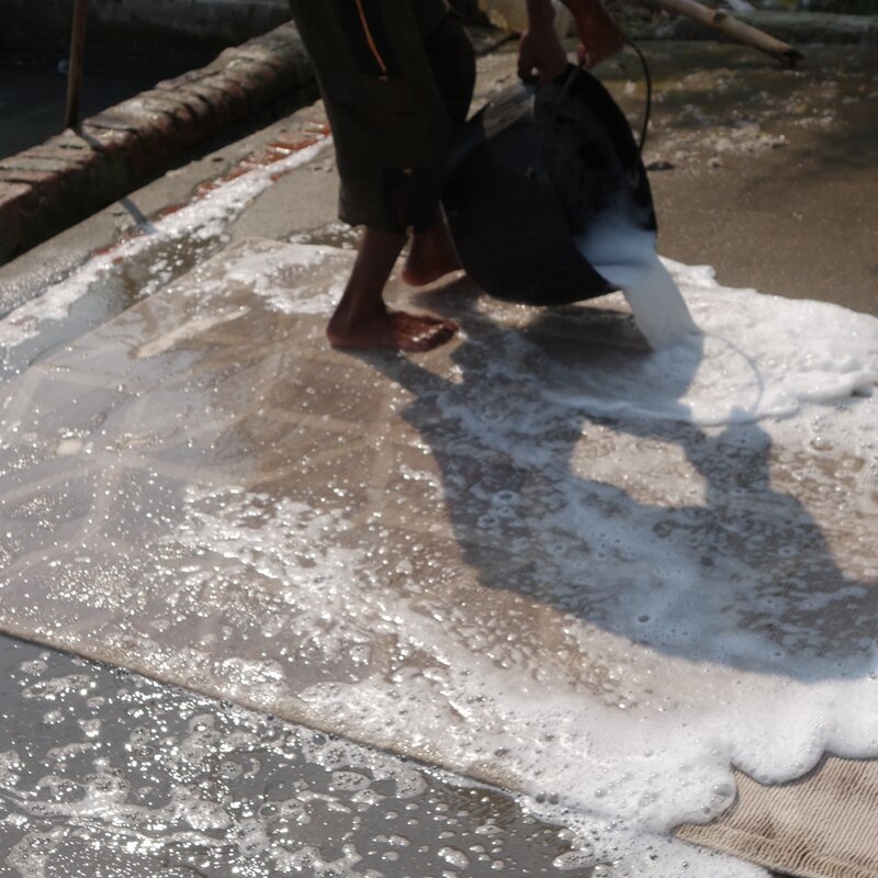 Rug production washing process