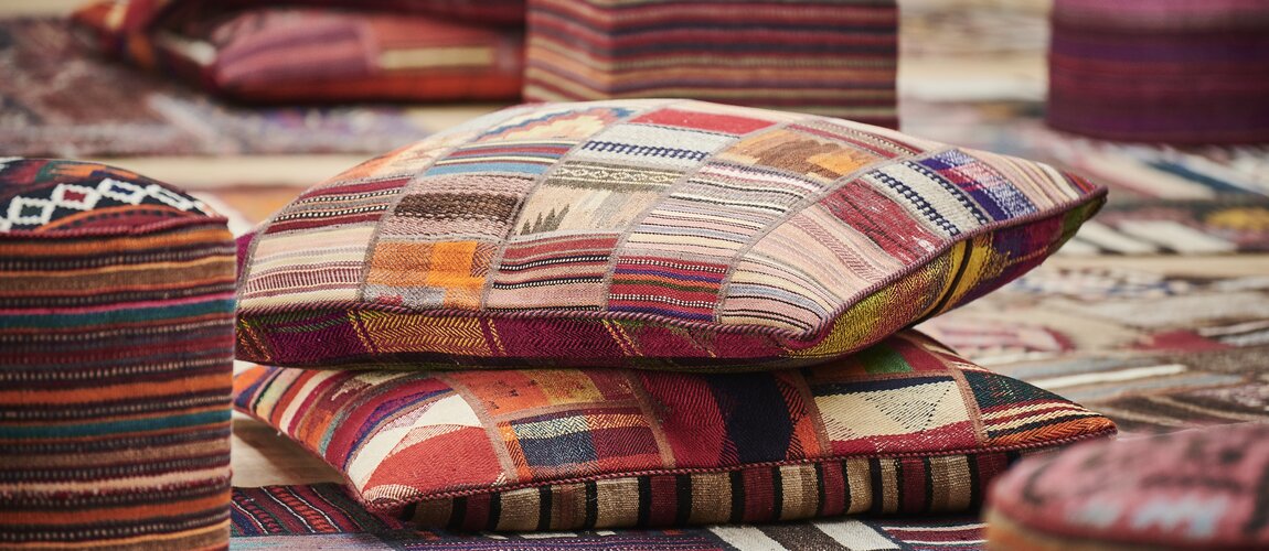 Kelim poufs and pillows in a pile